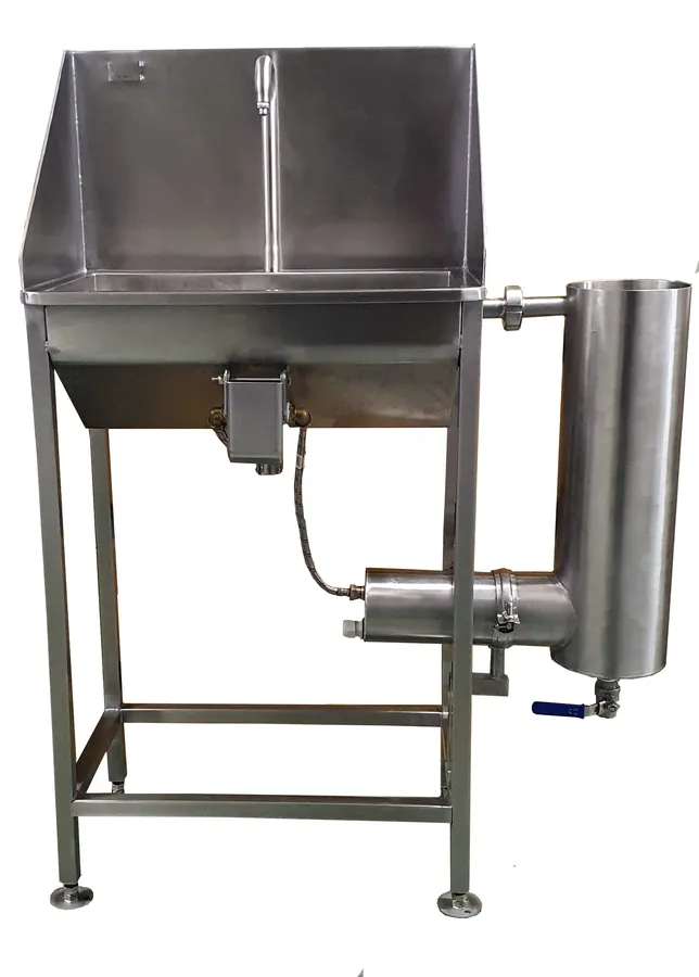 Stainless steel hand wash basin on legs with a cylindrical sterilizer mounted on the side