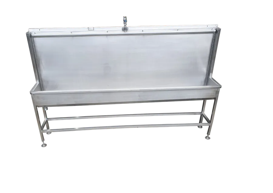 Urinals: Floor standing stainless steel trough urinal with splashback